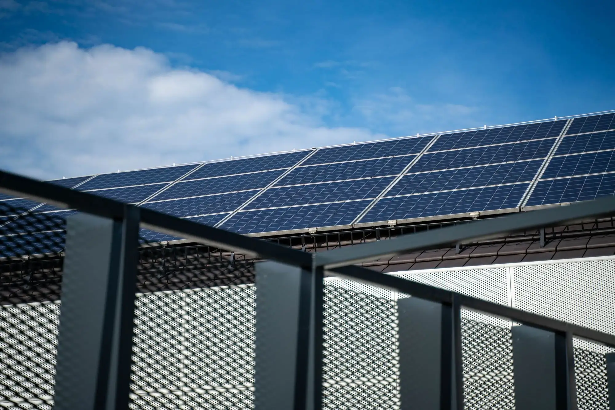 Rooftop solar panels feeding a home battery system